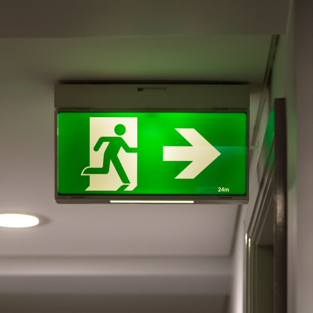Emergency exit lighting in a commercial corridor